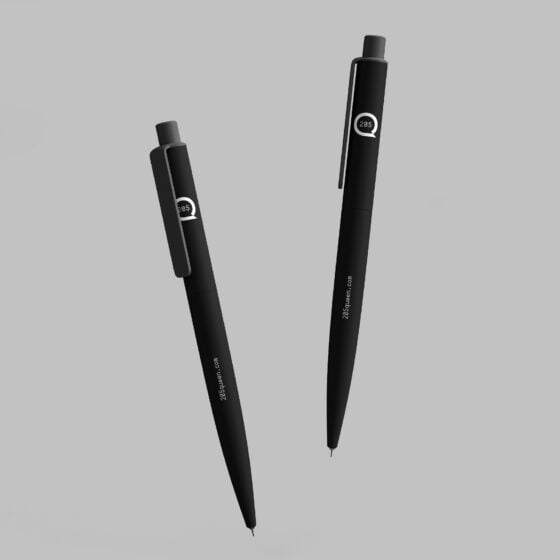Pens displaying a white logo for a real estate company
