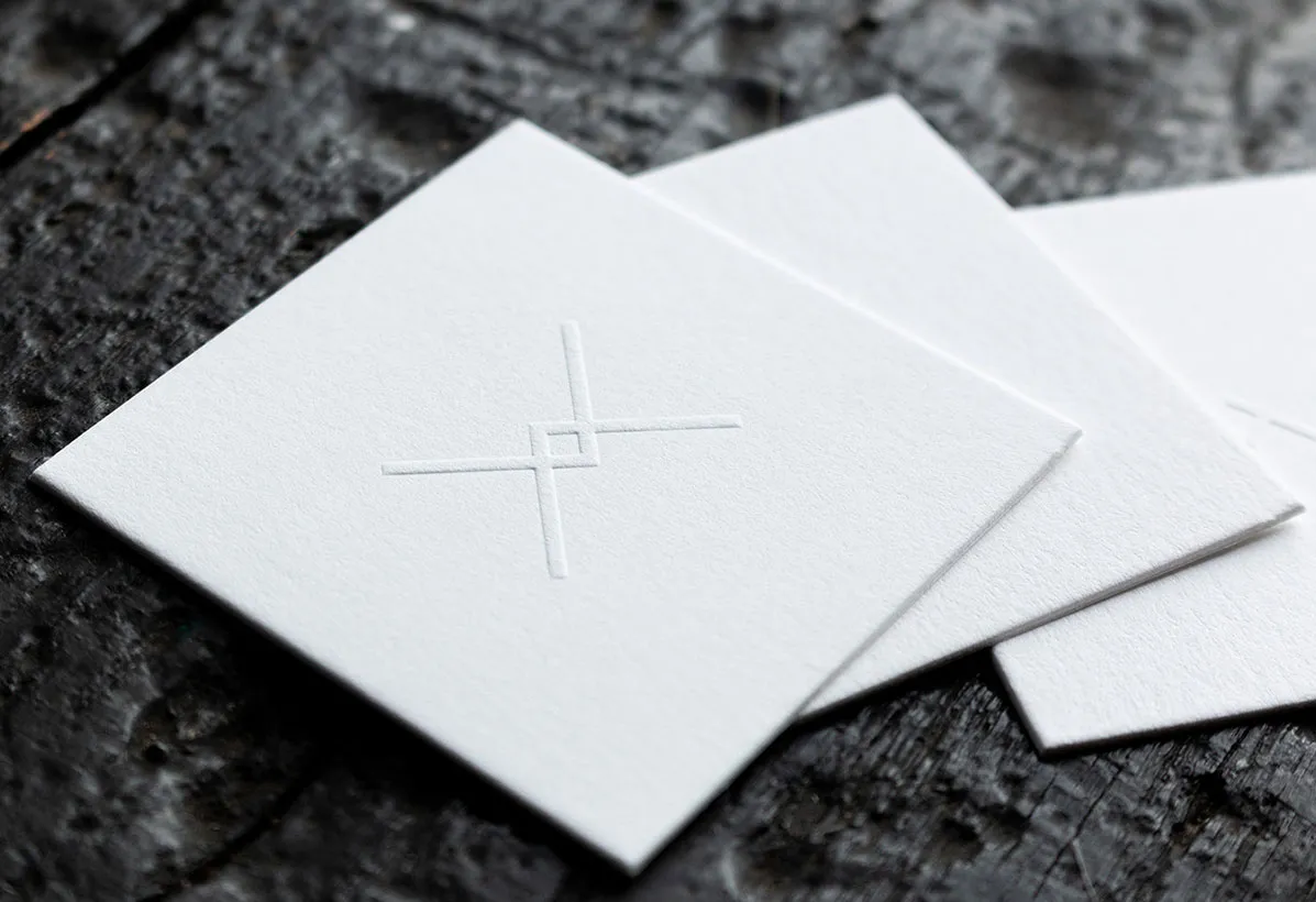 White raised embossed business cards