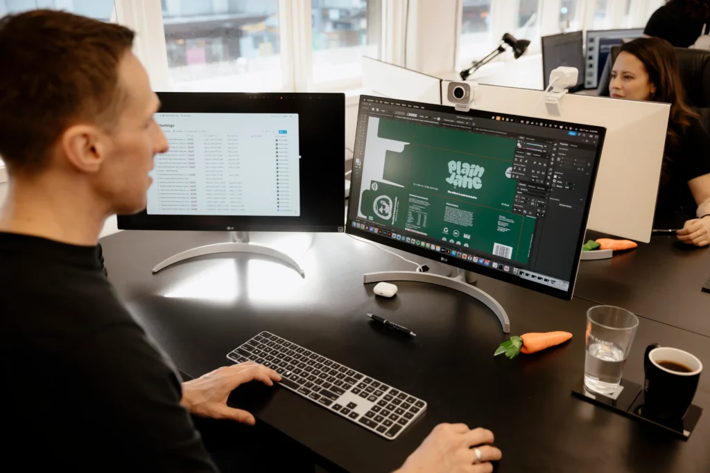 White Rabbit team working on custom graphic design in office for a client