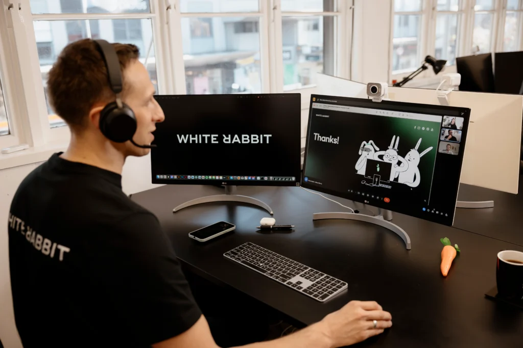 White Rabbit team working at office desk in meeting