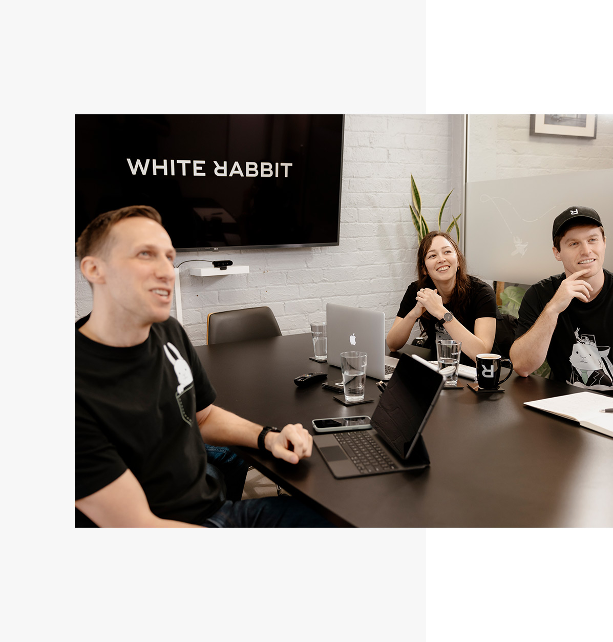 The website development team in a scope meeting